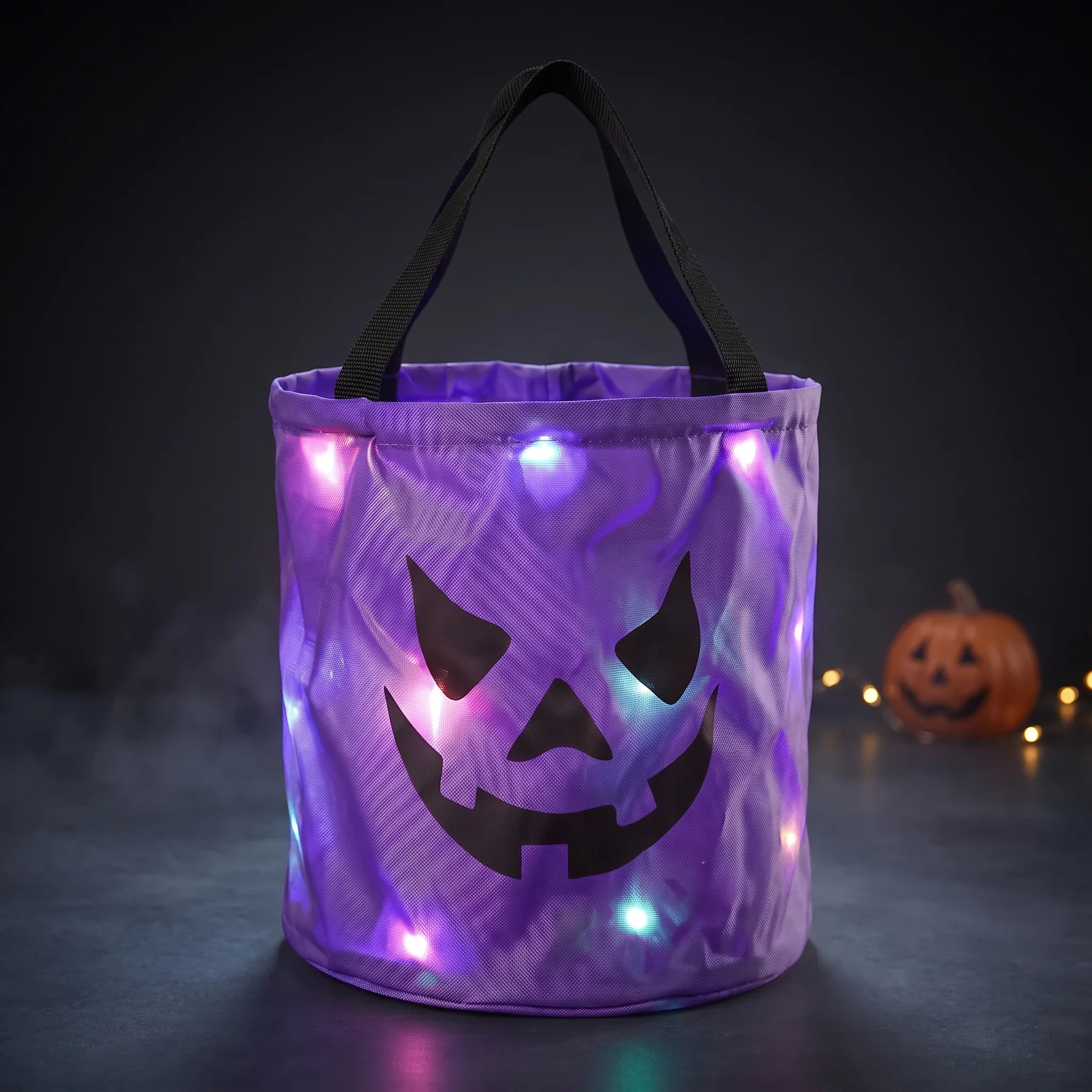 CandyGleam purple LED trick-or-treat bucket with glowing pumpkin face