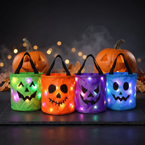 CandyGleam four LED light-up Halloween candy buckets in green, orange, purple and blue